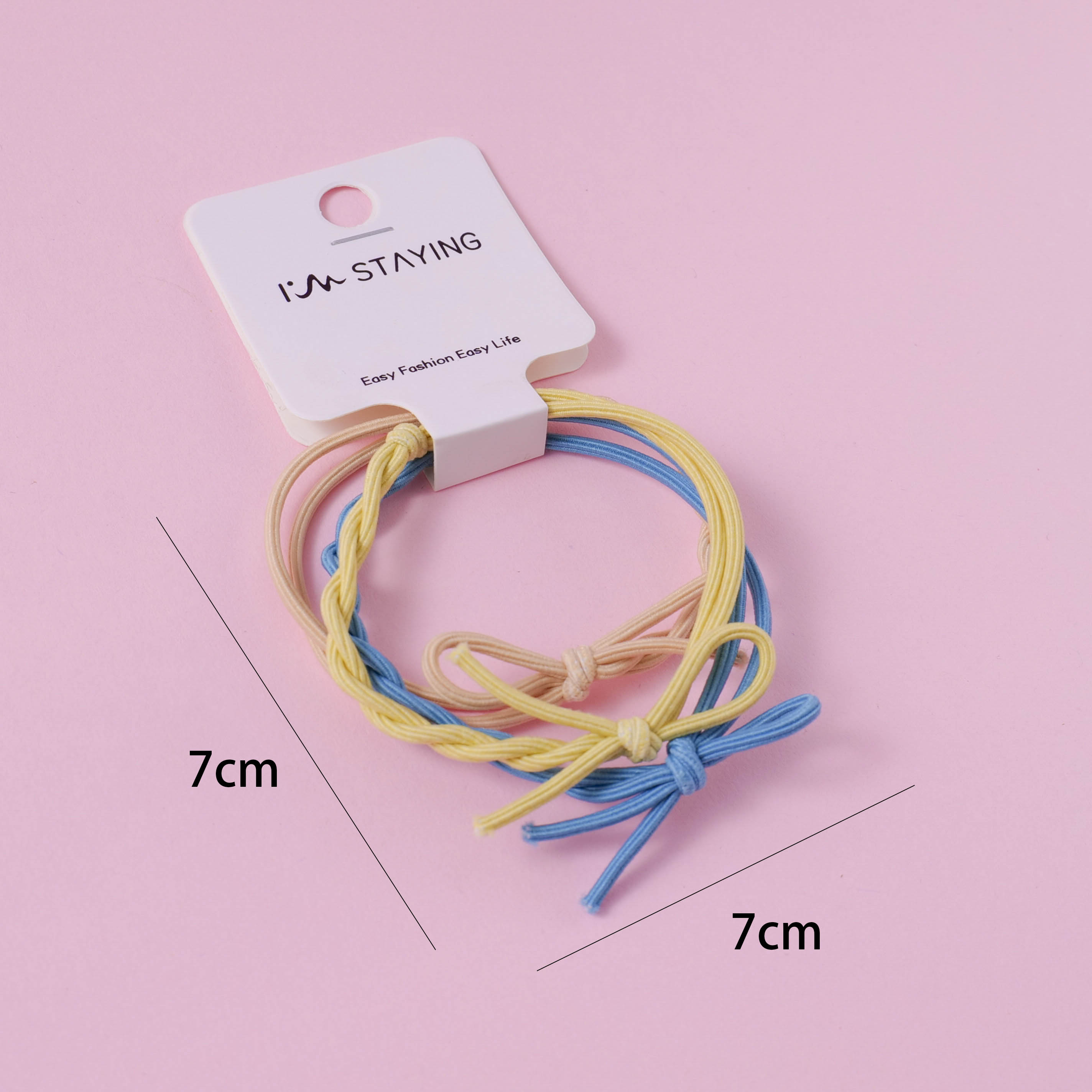 Two rubber bands for tying knots.