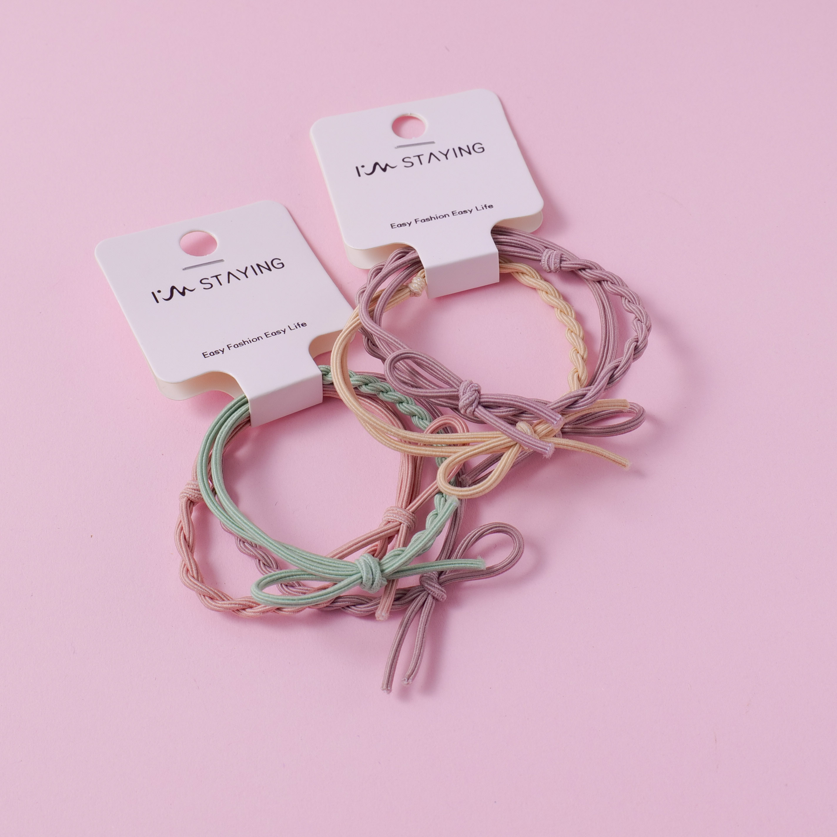 Two rubber bands for tying knots.