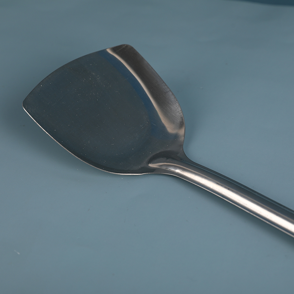 Square hole cooking shovel