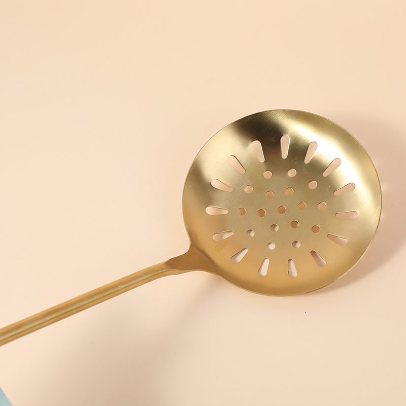 Gold-plated colander with wood handle