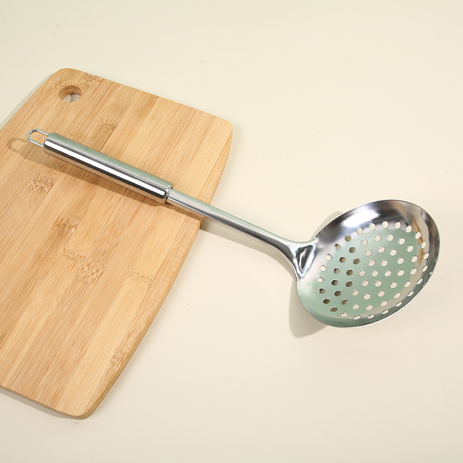 Slotted spoon with magnetic steel handle